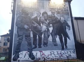 Bogside Artists' mural depicting a famous photograph from Bloody Sunday of the dying Jackie Duddy being carried by local men as a local priest Fr Edward Daly (later Bishop) tries to lead them to safety waving a blood stained white handkerchief. The mural is one of several which make up the People's Gallery in the Bogside, where the killings happened. Picture: JPIMedia