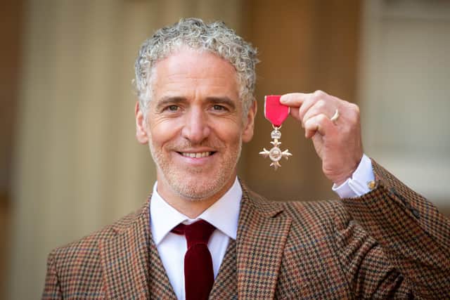 Cinematographer and Presenter Gordon Buchanan poses with his medal after being appointed a Member of the Most Excellent Order of the British Empire (MBE) for services to Conservation and to Wildlife Film-making following an investiture service at Buckingham Palace in London on March 12, 2020. (Photo by Dominic Lipinski / POOL / AFP) (Photo by DOMINIC LIPINSKI/POOL/AFP via Getty Images)