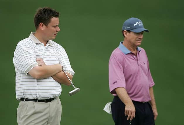 Stuart Wilson waits with Tom Watson on the first green during the second round of the 2005 Masters at Augusta National Golf Club. Picture: Andrew Redington/Getty Images.