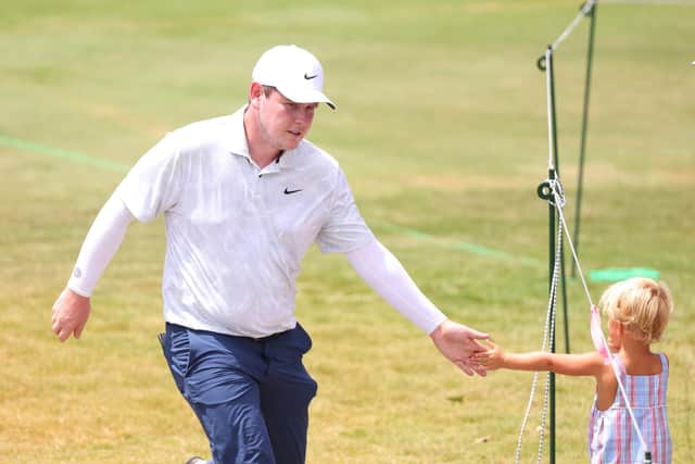 Bob MacIntyre high fives a young fan during the final round of the FedEx St. Jude Championship at TPC Southwind in Memphis, Tennessee. Picture: Mike Mulholland/Getty Images.