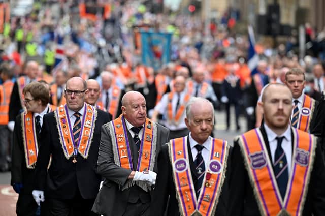 Members of the Orange Order and their supporters march through the city on September 18, 2021 in Glasgow, Scotland. Around 13,000 marchers are expected to take part in more than 50 parades through the city centre heading to Glasgow Green to celebrate the 200th anniversary of the first Battle of the Boyne parade in Glasgow. (Photo by Jeff J Mitchell/Getty Images)