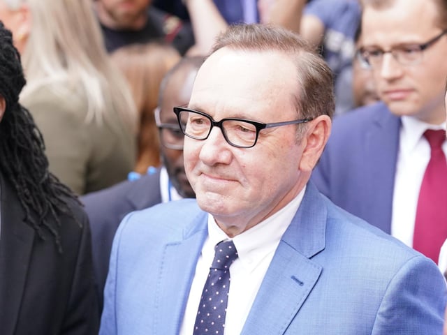 The 62-year-old former Hollywood star is accused of four counts of sexual assault and one count of causing a person to engage in penetrative sexual activity without consent.