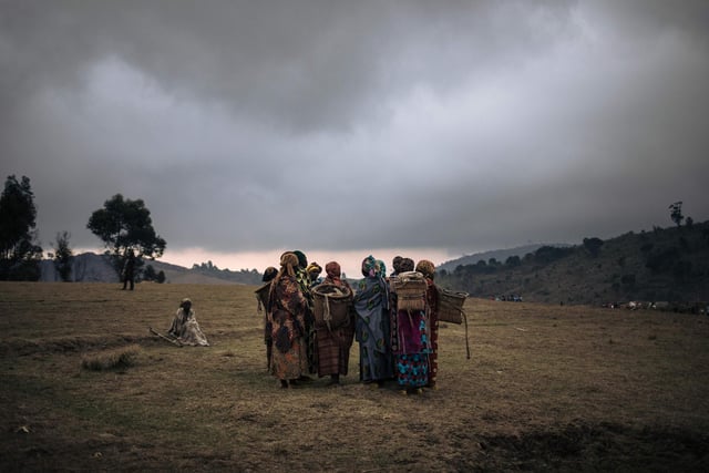 Displaced women gather for a discussion on recent kidnappings and sexual assaults committed by armed men around the internally displaced persons camp of Bijombo.