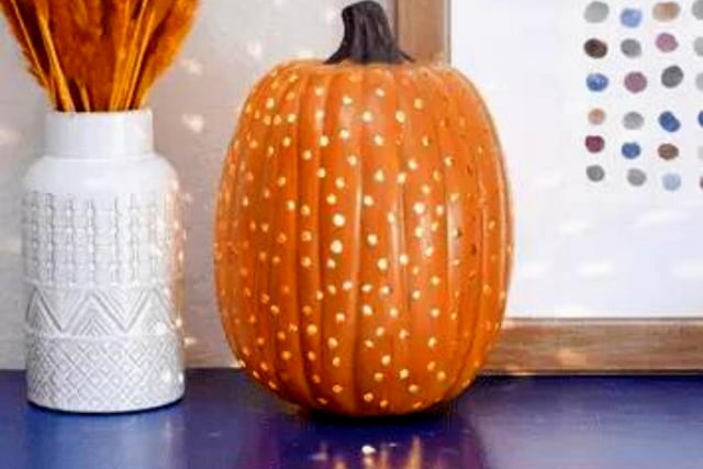 If you want to create something original this year but the idea of carving a face into your pumpkin seems laborious then this is the perfect design for you. Simply poke multiple holes into your pumpkin (using a screwdriver, for example) then set up a light on the inside - its minimal effort that results in a stylish aesthetic that shines like a disco ball.