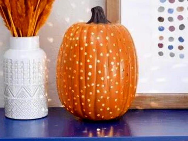 If you want to create something original this year but the idea of carving a face into your pumpkin seems laborious then this is the perfect design for you. Simply poke multiple holes into your pumpkin (using a screwdriver, for example) then set up a light on the inside - its minimal effort that results in a stylish aesthetic that shines like a disco ball.