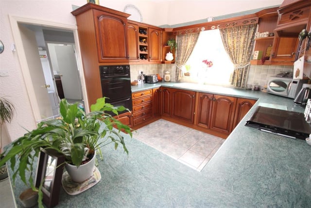 The kitchen boasts beautiful views over the garden.