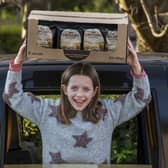 10-year-old Grace with some of her year's supply of crisps. Photo: Mike Wilkinson/Taylors Snacks/PA Wire