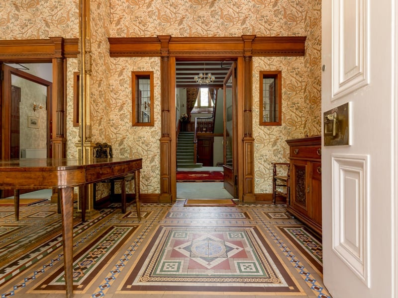 Inside, a breakfasting kitchen leads on to one of two conservatories, and the ground floor also has a dining room, drawing room, study and living room. The first floor has four bedrooms and a dressing room, while a two bedroom flat with sitting room and study is on the lower ground floor. The home’s gym, sauna, wine cellar and library are at basement level.
