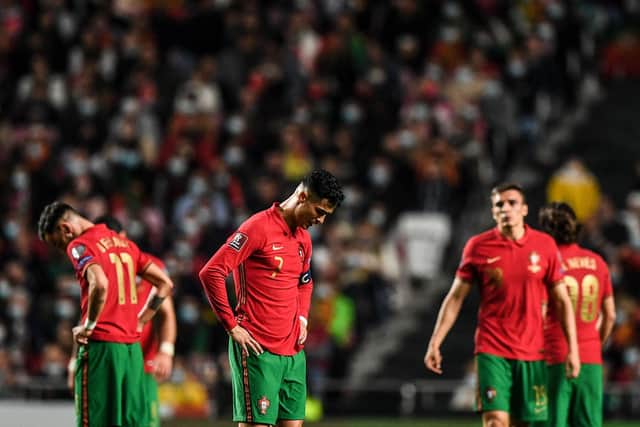 Cristiano Ronaldo reacts after defeat to Serbia condems Portugal to a World Cup play-off. (Photo by PATRICIA DE MELO MOREIRA/AFP via Getty Images)
