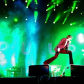 INDIO, CA - APRIL 13:  Singer Jarvis Cocker of Pulp performs onstage during day 1 of the 2012 Coachella Valley Music & Arts Festival at the Empire Polo Field on April 13, 2012 in Indio, California.  (Photo by Kevin Winter/Getty Images for Coachella)