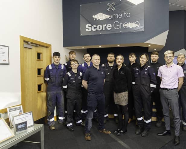 Score Group management team with some of the company's apprentices at its Peterhead HQ