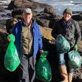Two of Select Scotland Guides on one of the many beach cleans around Scotland.