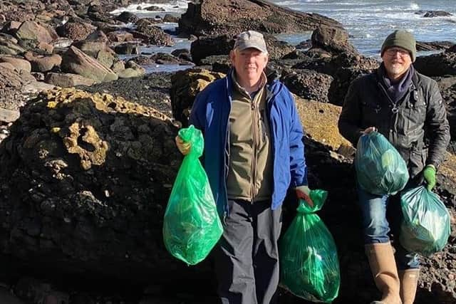 Two of Select Scotland Guides on one of the many beach cleans around Scotland.