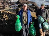 Two of Select Scotland Guides on one of the many beach cleans around Scotland.