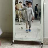 A child amputee practices walking with his prosthetic leg at an International Committee of the Red Cross (ICRC) hospital in Jalalabad in 2014 (Picture: Noorullah Shirzada/AFP via Getty Images)