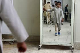 A child amputee practices walking with his prosthetic leg at an International Committee of the Red Cross (ICRC) hospital in Jalalabad in 2014 (Picture: Noorullah Shirzada/AFP via Getty Images)