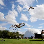 An acrobat from La Meute flies over the Circus Hub, the Fringe venue on the Meadows. Picture: Jane Barlow