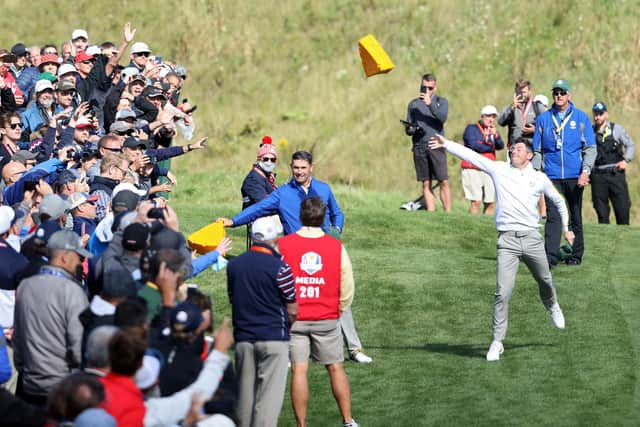 Rory McIlroy throws a cheese head hat into the crowd as the European team embark on a charm offensive (Photo by Warren Little/Getty Images)