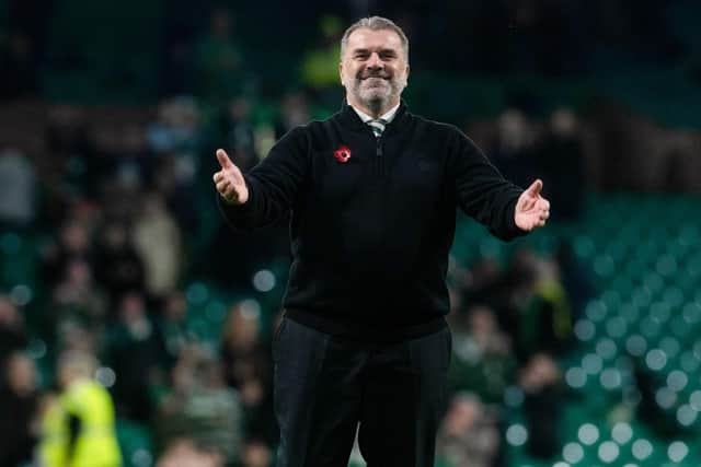 Celtic manager Ange Postecoglou takes the acclaim of the Celtic fans after the 2-1 win over Ross County.