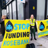 XR campaigners have smashed the windows of a Glasgow bank as they demand Barclays cut its ties with fossil fuel firms.
