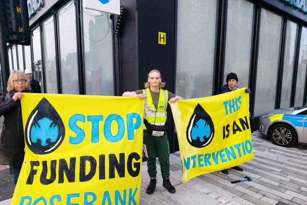 XR campaigners have smashed the windows of a Glasgow bank as they demand Barclays cut its ties with fossil fuel firms.