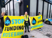 XR campaigners have smashed the windows of a Glasgow bank as they demand Barclays cut its ties with fossil fuel firms.