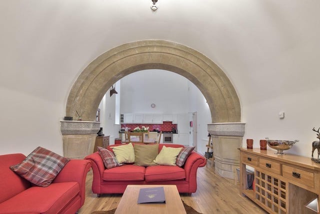 A particular highlight is the stone archway in the open plan kitchen dining living area.