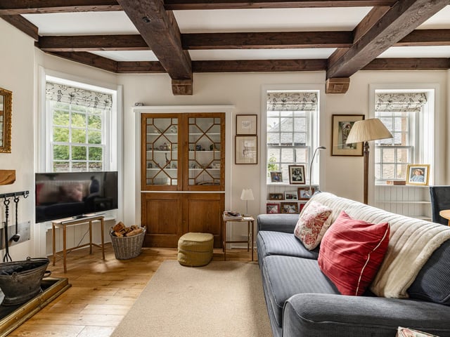 Interior: Crosford’s ground floor hosts a traditional-styled kitchen with room for a dining space, a cosy sitting room, and an office. Upstairs, there are two well-proportioned bedrooms, each with fireplaces.