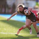 Scotland's Coreen Grant gets past Wales' Jenny Hesketh during the Six Nations opener in Cardiff.