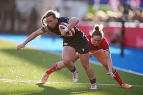 Scotland's Coreen Grant gets past Wales' Jenny Hesketh during the Six Nations opener in Cardiff.