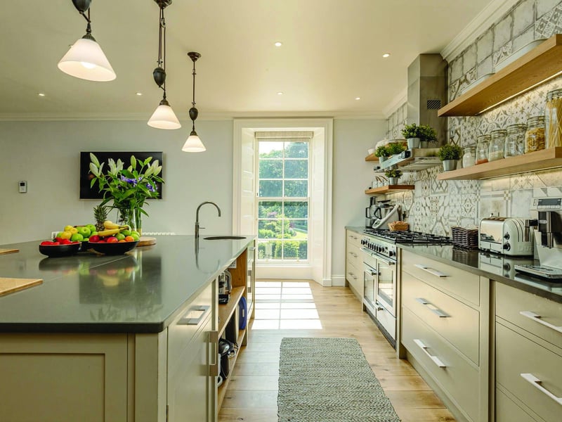 The couple introduced a family hub to the ground floor with a bespoke designer kitchen, dining space and garden room with full height windows overlooking the Water of Leith.