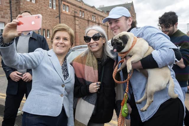 First Minister of Scotland Nicola Sturgeon (left) poses for selfies during a visit to Portobello, Edinburgh, while on the local election campaign trail. Picture: Lesley Martin/PA Wire