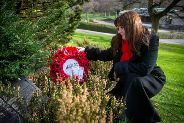 Theresa Davidson lays a wreath at the Falklands memorial in Edinburgh's Princes Street Gardens.