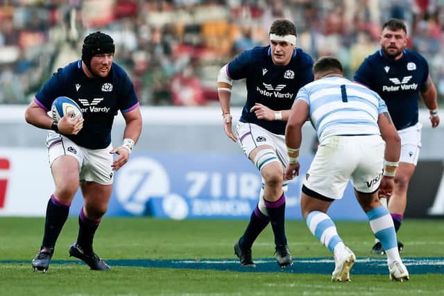 Zander Fagerson goes on the attack in what was his 50th game for Scotland. (Photo by Pablo Gasparini/AFP via Getty Images)