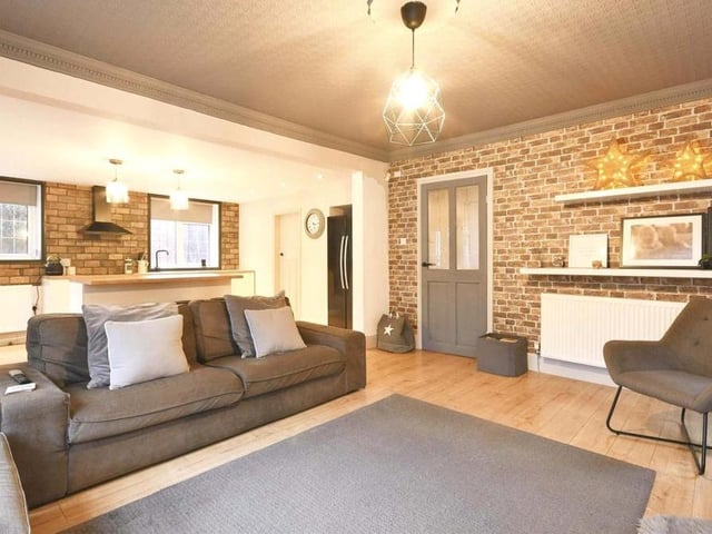 Another shot of the living area, which is spacious and versatile. Warmth is guaranteed because the double radiators throughout the home are new.