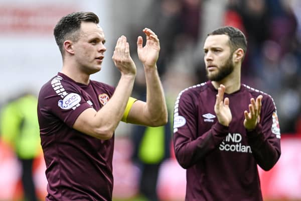 Hearts goalscorers Lawrence Shankland and Jorge Grant applaud the fans after beating Celtic.