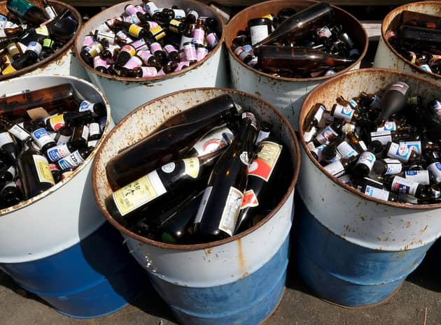 A small fortune in empties. Glasses and cans will come with a 20p refundable deposit from August next year (Picture: Kazuhiro Nogi/AFP via Getty Images)