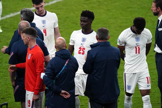 England manager Gareth Southgate stands dejected alongside Bukayo Saka and Jack Grealish following the UEFA Euro 2020 Final at Wembley Stadium, London picture: Mike Egerton