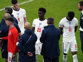 England manager Gareth Southgate stands dejected alongside Bukayo Saka and Jack Grealish following the UEFA Euro 2020 Final at Wembley Stadium, London picture: Mike Egerton