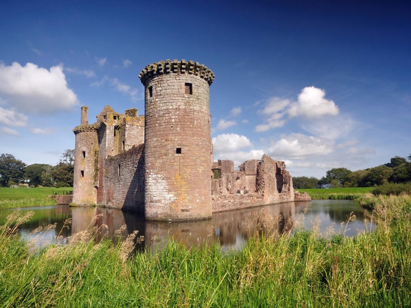 The moated triangular castle is situated on the southern coast of Scotland on the edge of the Caerlaverock National Nature Reserve. It was built around 1220 by Sir John De Maccuswell following a grant from Alexander II.