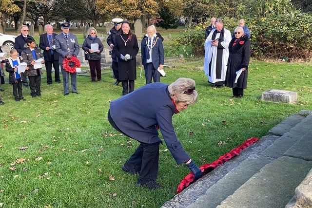 Ann Clouston OBE, who was representing the Territorial Army, laying her wreath during the service of Remembrance.