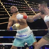 Scotland's Josh Taylor, right, punches Teofimo Lopez during the fourth round in New York, a fight Lopez would go on to win. (AP Photo/Frank Franklin II).