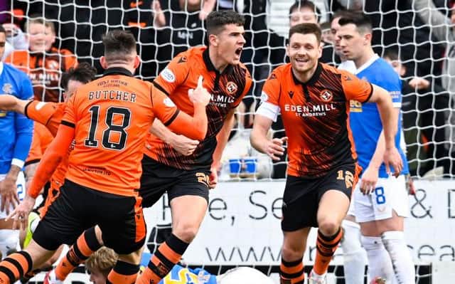 Dundee United defender celebrates opening the scoring for his team against Rangers at Tannadice. (Photo by Rob Casey / SNS Group)