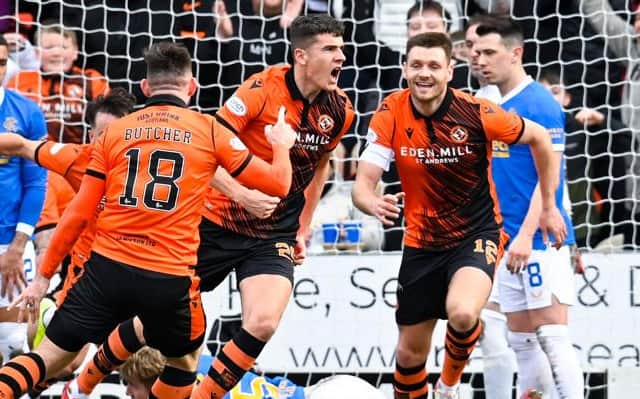 Dundee United defender celebrates opening the scoring for his team against Rangers at Tannadice. (Photo by Rob Casey / SNS Group)