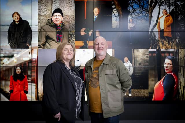 Nicola McCartney and photographer Chris Scott with images from his Ten Portraits exhibition 
