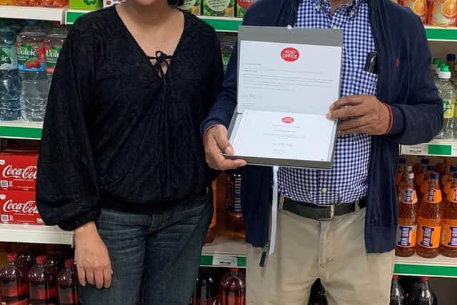 Livingston Village Postmaster Iqbal Mohammed with daughter Nadia