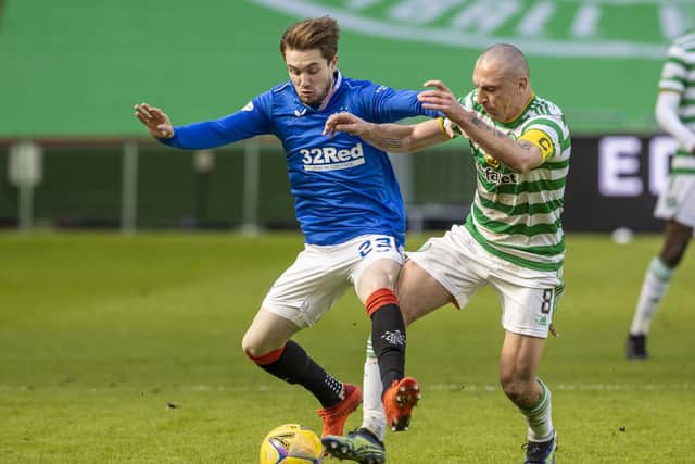 Rangers' Scott Wright (left) and Celtic's Scott Brown battle for possession during the Scottish Premiership match between Celtic and Rangers at Celtic Park, on March 21, 2021, in Glasgow, Scotland. (Photo by Alan Harvey / SNS Group)