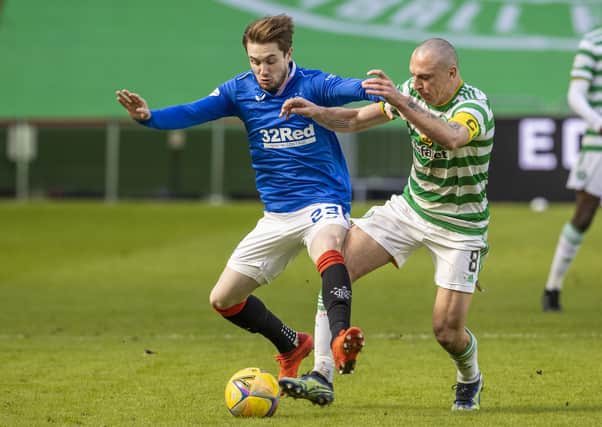 Rangers' Scott Wright (left) and Celtic's Scott Brown battle for possession during the Scottish Premiership match between Celtic and Rangers at Celtic Park, on March 21, 2021, in Glasgow, Scotland. (Photo by Alan Harvey / SNS Group)