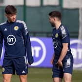 Scotland's Aaron Hickey, left, should edge out Greg Taylor , right, to earn a first cap in the absence of captain Andy Robertson for the Polish friendly. (Photo by Craig Williamson / SNS Group)