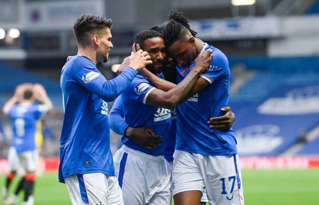 Jermain Defoe celebrates with Ianis Hagi and Joe Aribo after putting Rangers 2-0 up against Livingston at Ibrox on Sunday. (Photo by Rob Casey / SNS Group)